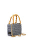 mini bag in woven raffia rectangular shape, two shiny bamboo handles and gold metal hooks with shoulder strap