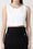 Top in misto lino con catena gioiello